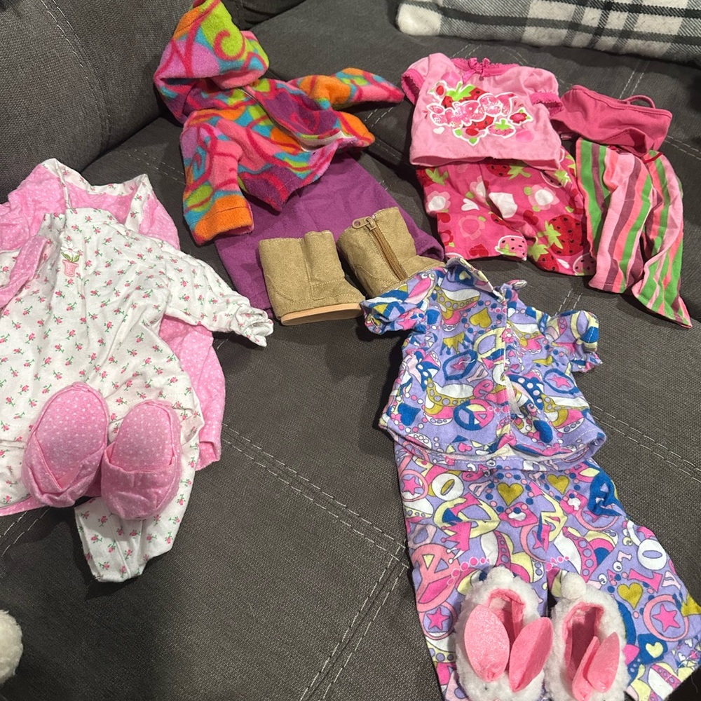 Clothes that fit American Girl Dolls. Generic brand. $15 for all.